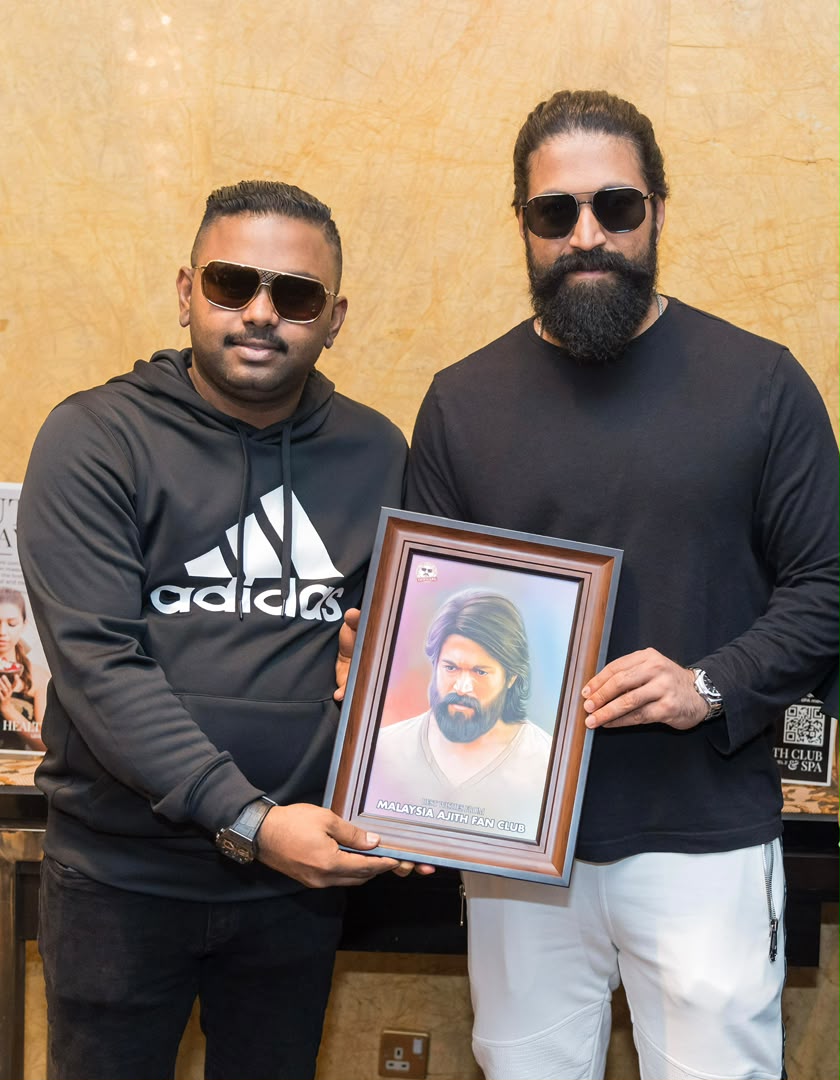 Founder Devendran Dev presenting digital portrait gift to Actor Yash in Malaysia